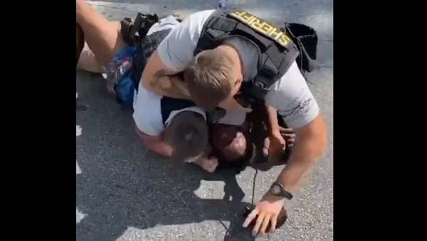 Clayton GA deputies pulled over a Lyft driver, but then beat the Black PASSENGER. Officers pressed his face on the PAVEMENT & punched him repeatedly because he didn't have his ID. Unbelievable... ANOTHER Black man saying “I can’t breathe” while being ASPHYXIATED by police!! - Sputnik International