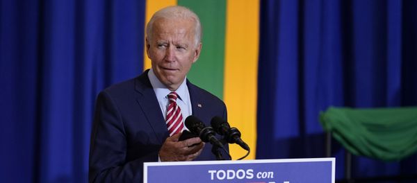 Democratic presidential candidate former Vice President Joe Biden plays music on a phone as he arrives to speak at a Hispanic Heritage Month event, Tuesday, Sept. 15, 2020, at Osceola Heritage Park in Kissimmee, Fla. - Sputnik International