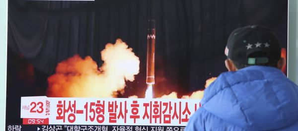 A man watches a TV screen showing what the North Korean government calls the Hwasong-15 intercontinental ballistic missile, at the Seoul Railway Station in Seoul, South Korea, 30 November 2017 - Sputnik International