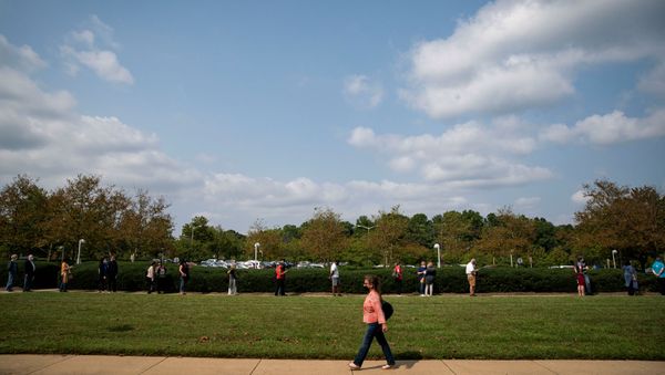 People wait in a socially distant line at an early voting site at the Fairfax County Government Center in Fairfax, Virginia, U.S., September 18, 2020. - Sputnik International