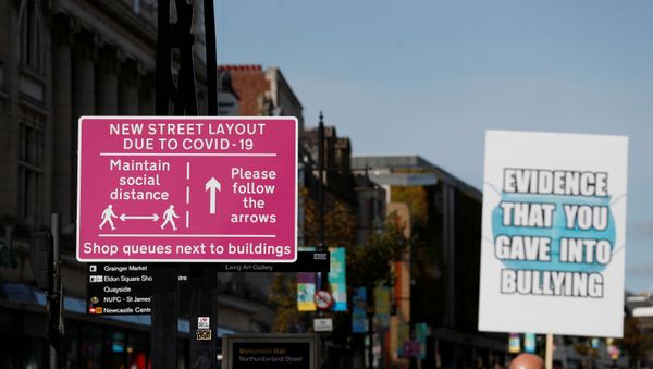 A social distancing sign is seen amid the spread of the coronavirus disease (COVID-19) in Newcastle, Britain, September 18, 2020.  - Sputnik International