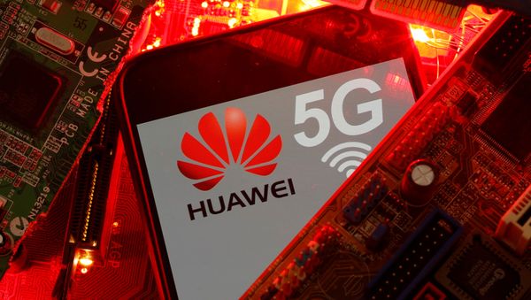 A smartphone with the Huawei and 5G network logo is seen on a PC motherboard in this illustration picture taken January 29, 2020 - Sputnik International