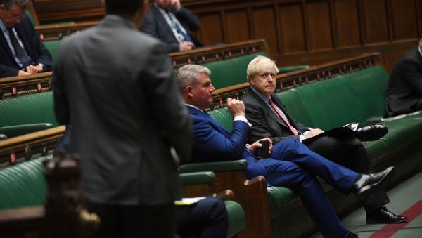 Britain's Prime Minister Boris Johnson looks on during a PM's statement session on the coronavirus disease (COVID-19) in the House of Commons, in London, 22 September 2020.  - Sputnik International