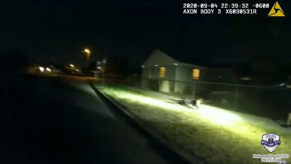 Newly released body camera footage captures the moment in which an officer with the Salt Lake City Police Department on September 4, 2020, repeatedly fired his gun on an autistic 13-year-old  who was having a mental health episode. Officers had been called on to provide the teen's mother with assistance in transporting the minor to a facility. - Sputnik International