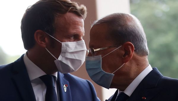 French President Emmanuel Macron and Lebanon's President Michel Aoun wear face masks as they arrives to attend a meeting at the presidential palace in Baabda, Lebanon September 1, 2020.  - Sputnik International
