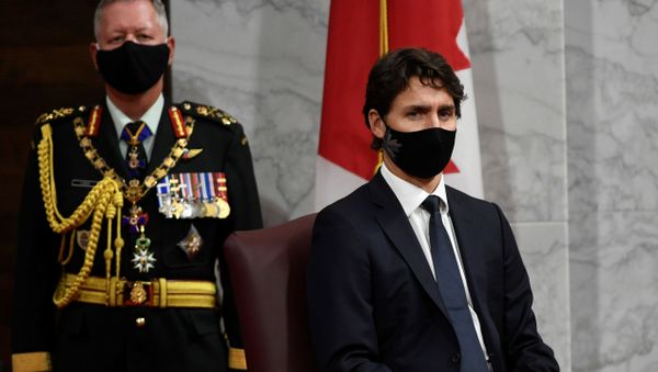Chief of Defence Staff Jonathan Vance and Prime Minister Justin Trudeau listen to Canada's Governor General Julie Payette delivering the throne speech in the Senate chamber in Ottawa, Ontario, Canada September 23, 2020.   - Sputnik International