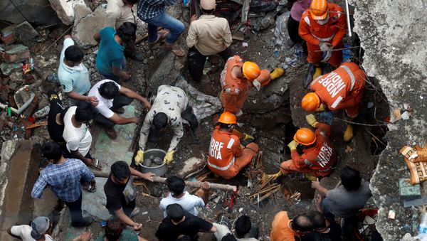 FILE PHOTO: National Disaster Response Force (NDRF) officials search for survivors as people help clear the rubble after a three-storey building collapsed in Bhiwandi, on the outskirts of Mumbai, India, September, 21 2020. FILE PHOTO: National Disaster Response Force (NDRF) officials search for survivors as people help clear the rubble after a three-storey building collapsed in Bhiwandi, on the outskirts of Mumbai, India, September, 21 2020. - Sputnik International