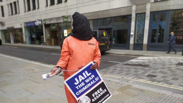 Hooded woman in orange jumpsuit replica outside Old Bailey during Mr Assange's extradition hearings 23 September 2020 Hooded woman in orange jumpsuit replica outside Old Bailey during Mr Assange's extradition hearings 23 September 2020 - Sputnik International