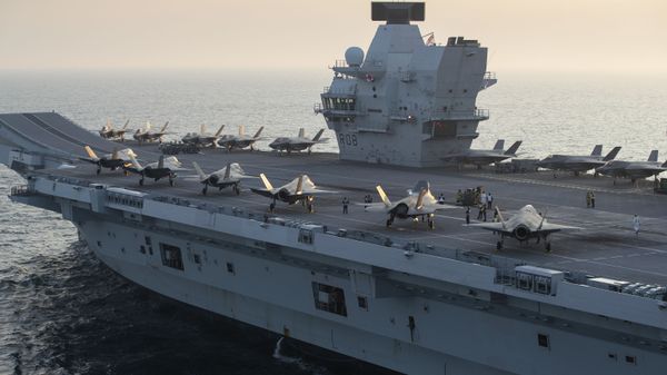 F-35B Lightning II Joint Strike Fighters assigned to Marine Fighter Attack Squadron (VMFA) 211 The Wake Island Avengers  and the United Kingdom's Lightning 617 Squadron shortly after embarking onboard HMS Queen Elizabeth on 22 September, 2020, off the coast of the United Kingdom. - Sputnik International