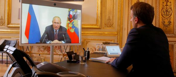 French President Emmanuel Macron listens to Russian President Vladimir Putin during a video conference at the Elysee Palace in Paris, France, June 26, 2020. French President Emmanuel Macron listens to Russian President Vladimir Putin during a video conference at the Elysee Palace in Paris, France, June 26, 2020. - Sputnik International
