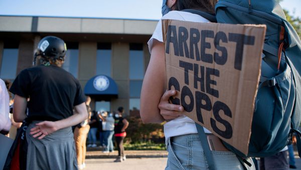 A woman holds a sign during a protest in front of the Kentucky Attorney General office in the case of Breonna Taylor, a Black woman who was shot dead in her apartment by police, in Louisville, Kentucky, U.S. September 18, 2020 - Sputnik International