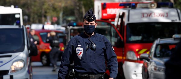 A police officer is seen at the scene of an incident near the former offices of French magazine Charlie Hebdo, in Paris, France September 25, 2020 A police officer is seen at the scene of an incident near the former offices of French magazine Charlie Hebdo, in Paris, France September 25, 2020 - Sputnik International