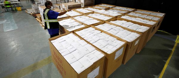 An election worker surveys thousands of absentee ballots awaiting preparation at the Wake County Board of Elections on the first day that the state started mailing out absentee ballots, in Raleigh, North Carolina, U.S. September 4, 2020.  - Sputnik International