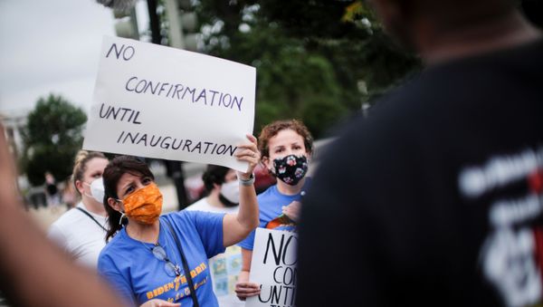 Protestors demonstrate outside the U.S. Supreme Court after U.S President Donald Trump announced U.S. Court of Appeals Judge Amy Coney Barrett as his nominee to fill the Supreme Court seat left vacant by the death of Justice Ruth Bader Ginsburg, in Washington, U.S., September 26, 2020 - Sputnik International
