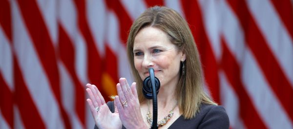 U.S. Court of Appeals for the Seventh Circuit Judge Amy Coney Barrett applauds as President Donald Trump holds an event at the White House in Washington DC, to announce her nomination to fill the Supreme Court seat left vacant on 18 September by the death of Justice Ruth Bader Ginsburg, 26 September 2020. U.S. Court of Appeals for the Seventh Circuit Judge Amy Coney Barrett applauds as President Donald Trump holds an event at the White House in Washington DC, to announce her nomination to fill the Supreme Court seat left vacant on 18 September by the death of Justice Ruth Bader Ginsburg, 26 September 2020. - Sputnik International