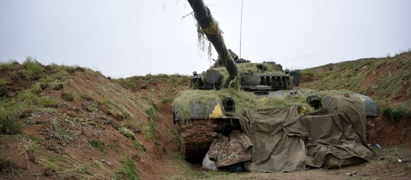 A T-64 tank of the Nagorno-Karabakh Defense Army on the first line of defense. A T-64 tank of the Nagorno-Karabakh Defense Army on the first line of defense. - Sputnik International