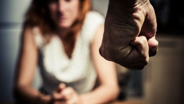 A man's clenched fist in front of a woman - Sputnik International