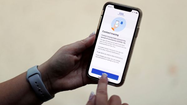 The coronavirus disease (COVID-19) contact tracing smartphone app of Britain's National Health Service (NHS) is displayed on an iPhone in this illustration photograph taken in Keele, Britain, September 24, 2020.  - Sputnik International