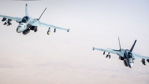 Two U.S. Navy F/A-18F Super Hornets assigned to Carrier Air Wing 17, deployed aboard the aircraft carrier USS Nimitz (CVN 68), fly over the U.S. Central Command area of responsibility Sept. 23, 2020. The F/A-18 Super Hornet is designed to perform fighter escort, fleet air defense, suppression of enemy air defenses, air interdiction, close air support, and aerial reconnaissance.  - Sputnik International