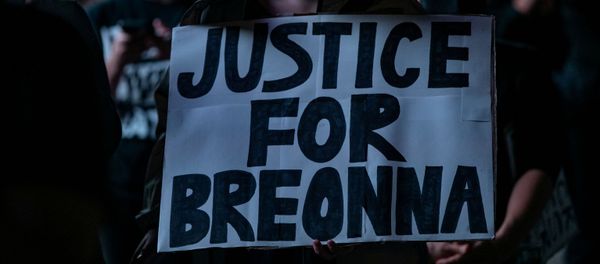 A woman holds a sign during the march for Breonna Taylor A woman holds a sign during the march for Breonna Taylor - Sputnik International