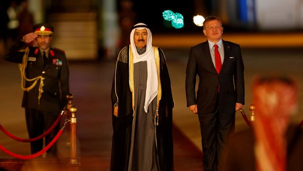 Jordan's King Abdullah II stands next to Emir of Kuwait Sabah Al-Ahmad Al-Jaber Al-Sabah during a reception ceremony at the Queen Alia International Airport in Amman, Jordan March 28, 2017 - Sputnik International