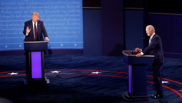 U.S. President Donald Trump and Democratic presidential nominee Joe Biden participate in their first 2020 presidential campaign debate held on the campus of the Cleveland Clinic at Case Western Reserve University in Cleveland, Ohio, U.S., September 29, 2020. - Sputnik International