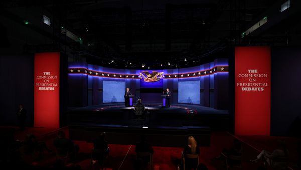 U.S. President Donald Trump and Democratic presidential nominee Joe Biden participate in their first 2020 presidential campaign debate held on the campus of the Cleveland Clinic at Case Western Reserve University in Cleveland, Ohio, U.S., September 29, 2020. - Sputnik International
