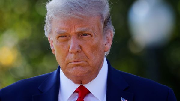 U.S. President Donald Trump approaches reporters as he departs on campaign travel to Minnesota from the South Lawn at the White House in Washington, U.S., September 30, 2020. - Sputnik International