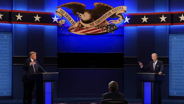 President Donald Trump, left, and Democratic presidential candidate former Vice President Joe Biden, right, with moderator Chris Wallace, center, of Fox News during the first presidential debate Tuesday, Sept. 29, 2020, at Case Western University and Cleveland Clinic, in Cleveland, Ohio. President Donald Trump, left, and Democratic presidential candidate former Vice President Joe Biden, right, with moderator Chris Wallace, center, of Fox News during the first presidential debate Tuesday, Sept. 29, 2020, at Case Western University and Cleveland Clinic, in Cleveland, Ohio. - Sputnik International