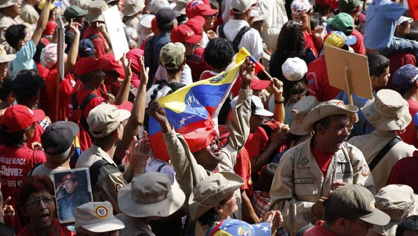 A supporter of Venezuela's President Nicolas Maduro shouts his support for him outside Miraflores presidential palace in Caracas, Venezuela, Monday, May 20, 2109. - Sputnik International