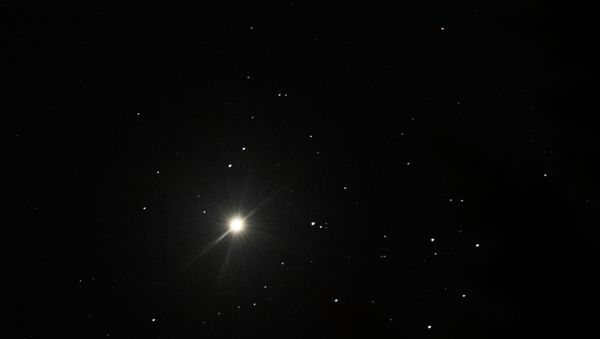The bright planet Venus appears in conjunction with the Pleiades star cluster, Friday, April 3, 2020, as seen from Olympia, Wash. The extra-close grouping of the planet with the star cluster commonly known as the seven sisters occurs approximately every eight years. - Sputnik International