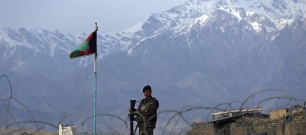 In this Wednesday, April 8, 2020, file photo, an Afghan National Army soldier stands guard at a checkpoint near the Bagram base north of Kabul, Afghanistan. In this Wednesday, April 8, 2020, file photo, an Afghan National Army soldier stands guard at a checkpoint near the Bagram base north of Kabul, Afghanistan. - Sputnik International
