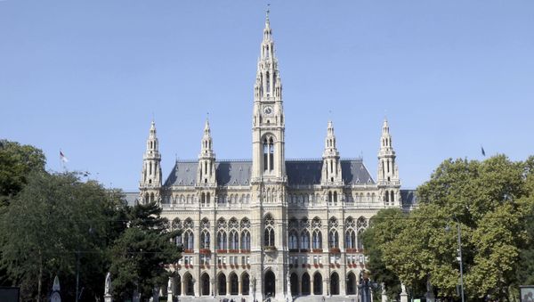 People walk in front of the City Hall in downtown Vienna, Austria, Saturday, Sep. 9, 2017 - Sputnik International
