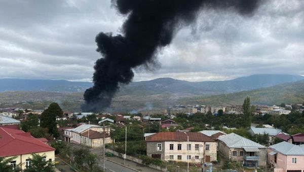 Smoke rises after the recent shelling, in Stepanakert, the self-proclaimed Republic of Nagorno-Karabakh. The situation in Nagorno-Karabakh escalated on September 27, when Yerevan and Baku accused each other of provoking military hostilities. - Sputnik International
