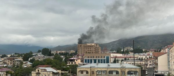 Smoke rises after the recent shelling, in Stepanakert, the self-proclaimed Republic of Nagorno-Karabakh. The situation in Nagorno-Karabakh escalated on September 27, when Yerevan and Baku accused each other of provoking military hostilities. - Sputnik International