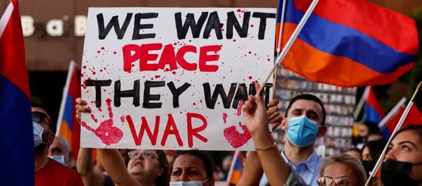 People take part in a protest by Armenian Youth Federation against what they call Azerbaijan's aggression against Armenia and the breakaway Nagorno-Karabakh region outside the Azerbaijani Consulate General in Los Angeles, California, U.S., September 30, 2020.  - Sputnik International