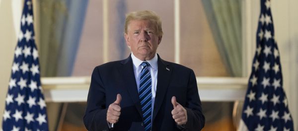 President Donald Trump gives thumbs up on the Blue Room Balcony upon returning to the White House Monday, Oct. 5, 2020, in Washington, after leaving Walter Reed National Military Medical Center, in Bethesda, Md. - Sputnik International