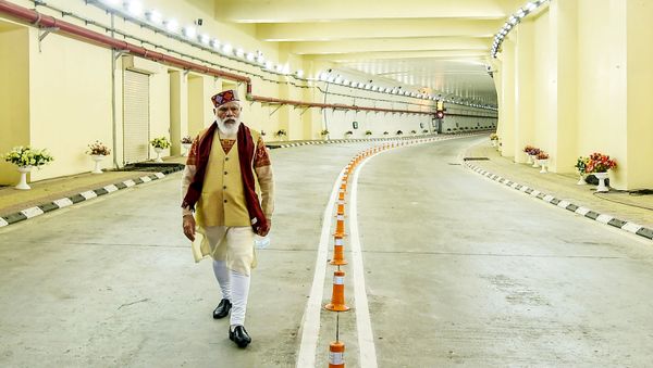 In this handout photograph taken on October 3, 2020 and released by the Indian Press Information Bureau (PIB), India's Prime Minister Narendra Modi walks on a road inside the Highway Atal tunnel, near Manali in Himachal Pradesh state. - Sputnik International
