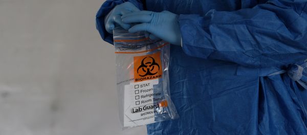 A biohazard bag is used for containing a specimen for a coronavirus disease (COVID-19) test A biohazard bag is used for containing a specimen for a coronavirus disease (COVID-19) test - Sputnik International