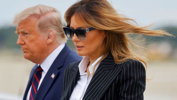 U.S. President Donald Trump walks with first lady Melania Trump at Cleveland Hopkins International Airport in Cleveland, Ohio, U.S., September 29, 2020. Picture taken September 29, 2020 - Sputnik International