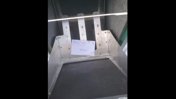 Screenshot from a video revealing an election box in Lansing, Michigan, opened and having one election mailing inside - Sputnik International