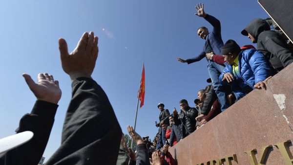 People protest during a rally on the central square in Bishkek, Kyrgyzstan, Wednesday, Oct. 7, 2020. Officials in Kyrgyzstan have nullified the results of a weekend parliamentary election after mass protests erupted in the capital of Bishkek and other cities, with opposition supporters seizing government buildings and demanding a new vote. - Sputnik International