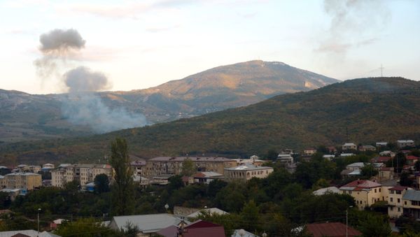 Smoke rises after an artillery strike in Stepanakert, Nagorno-Karabakh - Sputnik International
