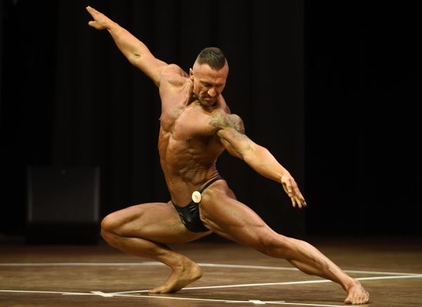 A bodybuilder performs at the championship in Kazan A bodybuilder performs at the championship in Kazan - Sputnik International
