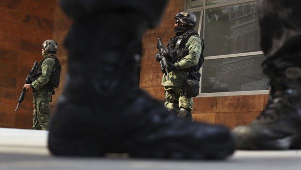 Security agents stand guard outside the apartment building where Damaso Lopez, nicknamed El Licenciado, was captured in the Anzures neighborhood of Mexico City, Tuesday, May 2, 2017. , May 2, 2017. Mexican prosecutors said they captured Lopez, one of the Sinaloa cartel leaders who launched a struggle for control of the gang following the re-arrest of Joaquin El Chapo Guzman - Sputnik International
