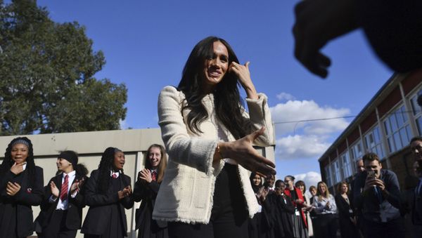 Britain's Meghan, Duchess of Sussex, is greeted by pupils at the Robert Clack Upper School in Dagenham, Essex to the east of London, during a surprise visit to celebrate International Women's Day, Friday, 6 March 2020. - Sputnik International