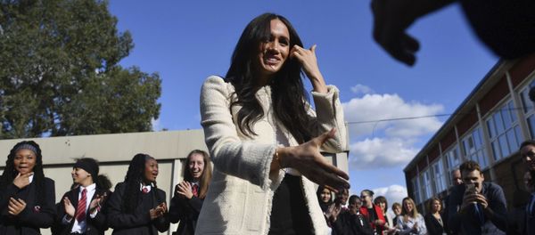 Britain's Meghan, Duchess of Sussex, is greeted by pupils at the Robert Clack Upper School in Dagenham, Essex to the east of London, during a surprise visit to celebrate International Women's Day, Friday, 6 March 2020. Britain's Meghan, Duchess of Sussex, is greeted by pupils at the Robert Clack Upper School in Dagenham, Essex to the east of London, during a surprise visit to celebrate International Women's Day, Friday, 6 March 2020. - Sputnik International