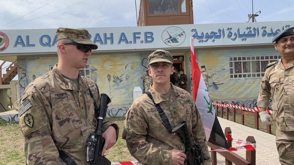 U.S. soldiers stand guard during the hand over ceremony of Qayyarah Airfield, Iraqi Security Forces, in the south of Mosul, Iraq  early Friday, March 27, 2020. Iraq's military on Thursday said at least two rockets hit inside Baghdad's heavily fortified Green Zone, the seat of Iraq's government and home to the American Embassy, in the first attack following a brief lull in violence from earlier this month.  - Sputnik International