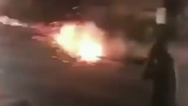 Screenshot from a video showing a group of hooded young people launching fireworks at moving cars in Sheffield, the UK, 11 October 2020 - Sputnik International