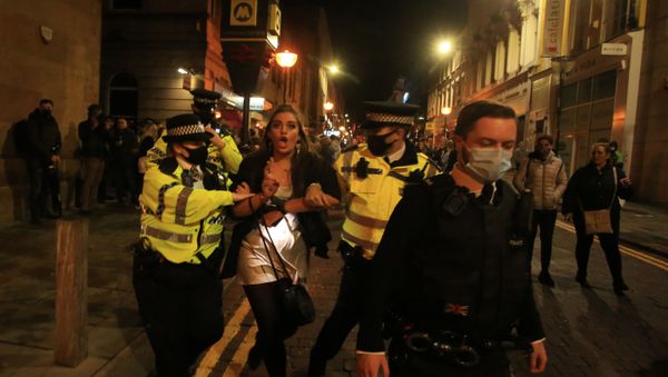 Police patrol as revellers enjoy a night out in the centre of Liverpool, north west England on October 10, 2020 ahead of new measures set to be introduced in the northwest next week to help stem the spread of the novel coronavirus - Sputnik International